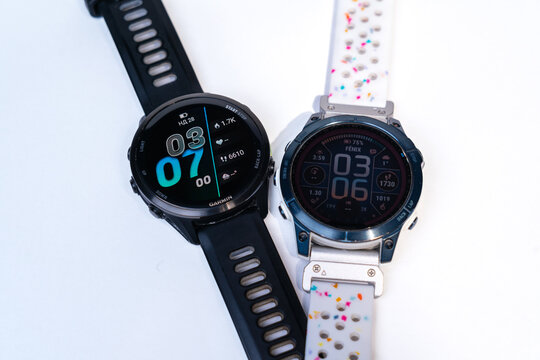 28.12.2025 - Kyiv, Ukraine: Garmin Fenix 7 Saphire Solar blue color vs Garmin Forerunner 970