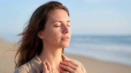 Woman practicing mindful breathing on beach with eyes closed for wellness meditation mental health and coastal lifestyle advertising