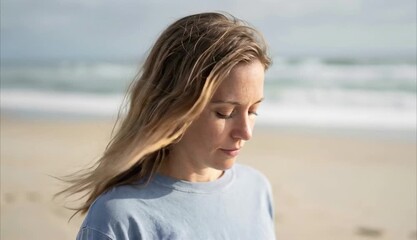 Calm woman walking on beach with ocean background for wellness mindfulness coastal travel and lifestyle advertising