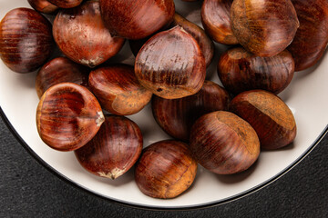 Obraz premium Edible chestnuts delicious treat tasty snack fresh gourmet food background on table rustic food top view copy space