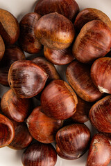 Obraz premium Edible chestnuts delicious treat tasty snack fresh gourmet food background on table rustic food top view copy space