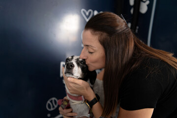 Woman showing affection and love to her dog