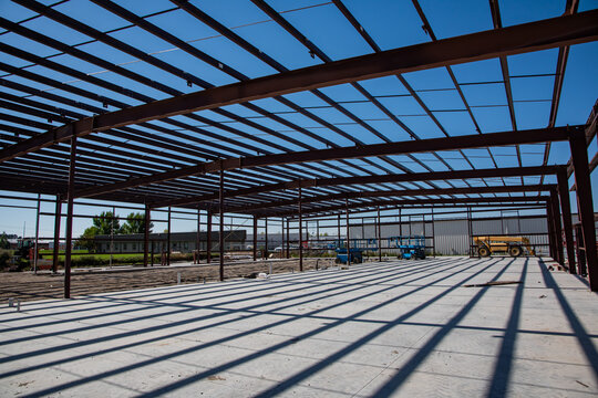 Commercial steel frame building in construction process.