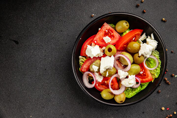 Feta salad green olives, tomato, onion, green leaf lettuce seafood natural healthy food main course ingredient appetizer fresh tasty gourmet on the table rustic food copy space food background