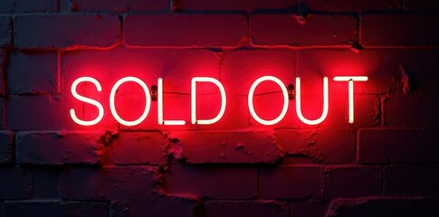 Bright neon SOLD OUT sign against a rough red wall , message, closed, display