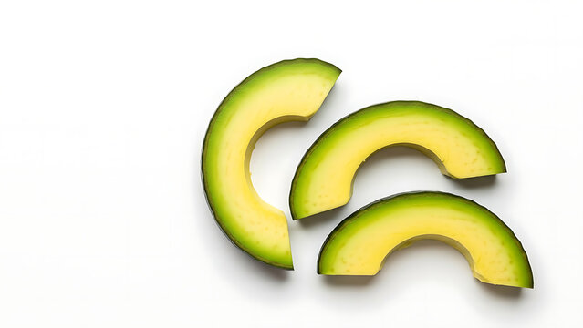 Sliced avocado pieces on white background slices green