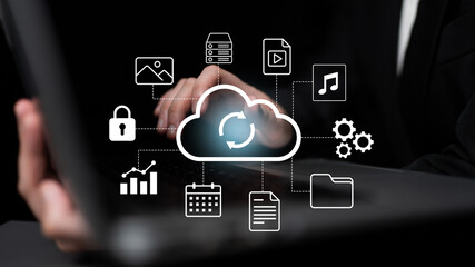 Visual representation of cloud computing with hands on laptop. Symbols illustrate data transfer, security, and multimedia, showcasing the modern technology landscape. Gantry