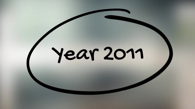 Year 2011 Handwriting with Black Marker on Glass Surface