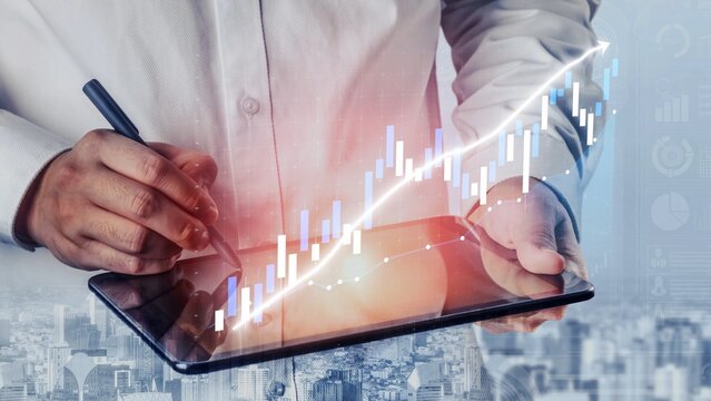 A business professional engages with a digital tablet, analyzing financial data depicted through a growth chart overlay, reflecting technology role in modern finance. Copula - Powered by Adobe