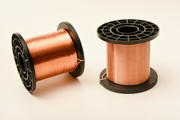 Copper coils on a white background. Copper wire for electronics. Pure copper.
