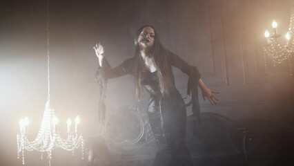 Gothic fashion portrait showing a femme fatale in black godet dress with corset, featuring long straight hair, dark makeup, and set in an opulent dark interior.