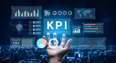 A hand reaches out toward a digital business dashboard, showcasing key performance indicators and...