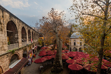 Koza Inn, located in Bursa province of Türkiye, was built in the 15th century by II. It was built by Bayezid. Today, many workplaces and cafeterias provide service in Koza Han. © Ali
