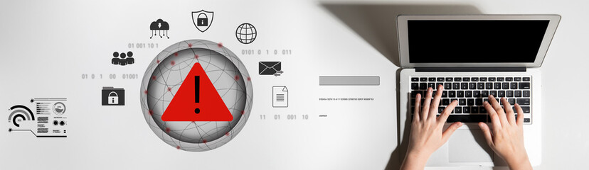 Red warning triangle representing a cybersecurity threat or data breach alert, surrounded by...