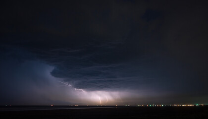 dark horizon with intermittent lightning glow, long exposure atmospheric depth