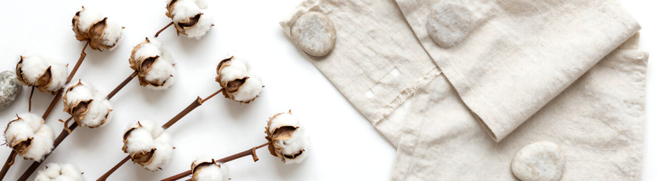 warm flat lay features rustic arrangement cotton plants weathered stones linen fabric swatches soothing neutral