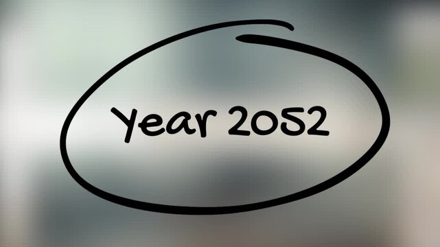 Year 2052 Handwriting with Black Marker on Glass Surface