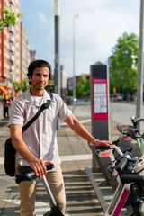 Indian man renting an electric bicycle from a city station, promoting sustainable eco friendly urban mobility for citizens