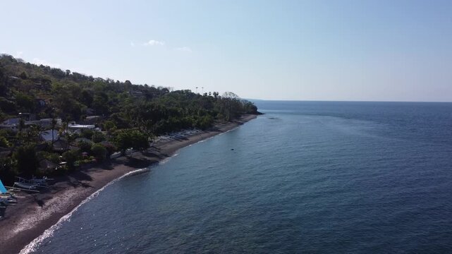 Aerial view taken by drone in good weather of the Amed coastline in Bali