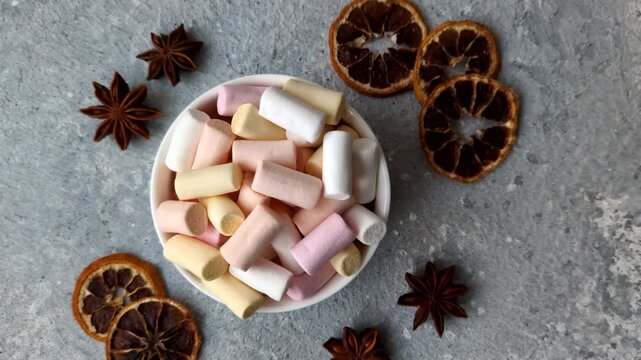 Mini marshmallows in white, pink, and pastel colors, a colorful Christmas dessert. Marshmallows as a food background for your design