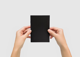 Hands Holding Blank Black Brochure Mockup