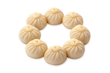 Steamed Chinese buns arranged with a transparent background on black.