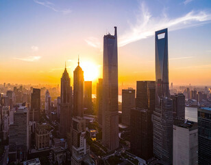 Capture the essence of urban growth with this cinematic golden hour skyline. The towering architecture and warm sun represent economic power and a futuristic global business hub.