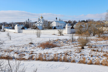 Suzdal, Russia, Pokrovsky Monastery and frozen Kamenka river