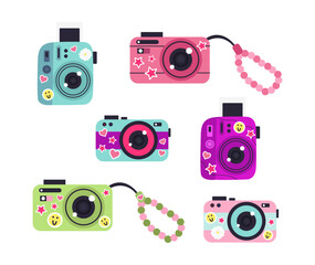 Illustration of cute cameras with stickers on a white background.