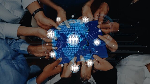 Hands from diverse individuals hold a blue digital network map, symbolizing global teamwork and collaboration in a modern business landscape, representing unity and progress. Raster - Powered by Adobe