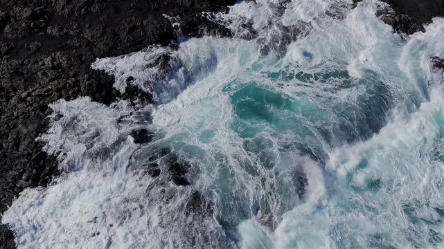 Volcanic Hydro-Explosion: 4K View of the Atlantic Ocean Surging Through the Basaltic Blowholes of El Bufadero de la Garita, Gran Canaria, Canary Islands, Spain