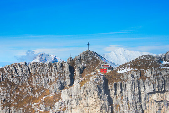 Mount Resegone and the Azzoni Alpine refuge (Italian: Rifugio Azzoni), seen from the Sentiero delle Creste, a trail for expert hikers among vertical cliffs and limestone crags. Lombardy, Italy