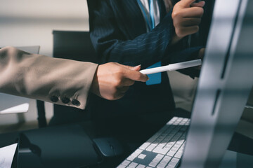 Close up high angle Asian businesswoman working with her coworker in meeting room
