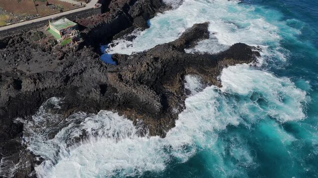 Volcanic Hydro-Explosion: 4K View of the Atlantic Ocean Surging Through the Basaltic Blowholes of El Bufadero de la Garita, Gran Canaria, Canary Islands, Spain