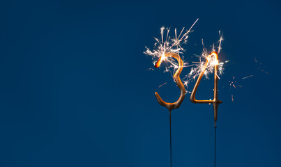 34 years celebration festive background made with Bengal fires in the form of number Thirty four.