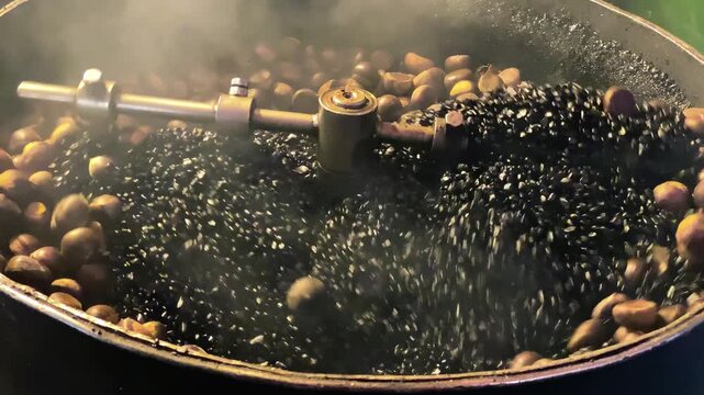 Cooking chestnuts along the street at night