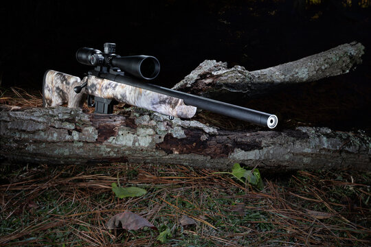 Bolt action rifle readied to shoot in the field