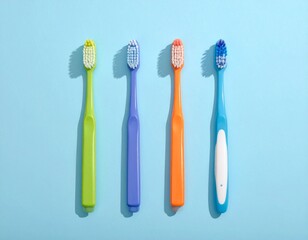 Minimalist Overhead View of Multicolored Modern Toothbrushes on Light Blue Surface