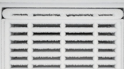 A close-up view of a white air vent with frosty slats Generative AI.