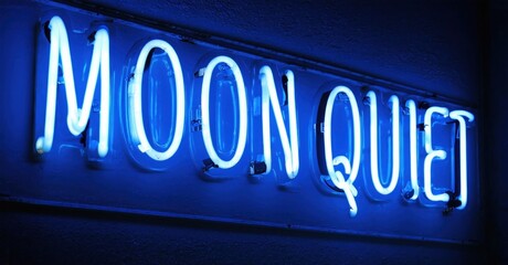 Obraz premium Bright blue neon sign displays words Moon Quiet. Dark background emphasizes glowing text. Simple, modern aesthetic.