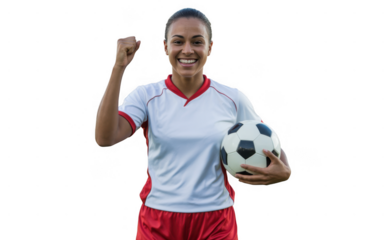 Happy female soccer player celebrating success with a football and fist pump