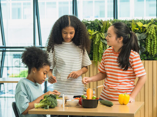 Group three children prepare healthy meal together in bright, modern kitchen. Surrounded fresh vegetable like bell pepper broccoli carrot engage in fun and education cook activity. creating vibrant