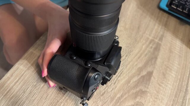 Woman Mounting Camera Lens Carefully, Woman With Pink Nails Installs Lens Onto Camera Body Carefully