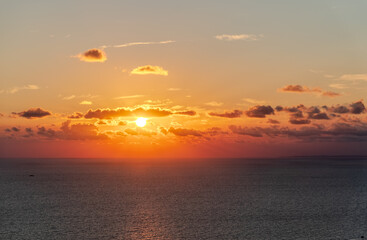 Fototapeta premium Beautiful red and orange sunrise over the sea.