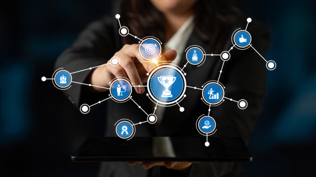A professional person selecting digital icons on a tablet, symbolizing achievement and connection in a tech-driven business environment. Tessel - Powered by Adobe