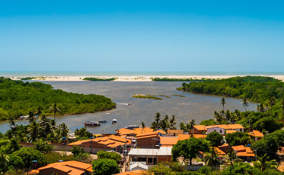 Panoramic view of Preguicas river estuary with mangroves, sand Dunes and colorful village houses of  Barreirinhas, Maranhao, Brazil