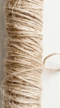 Video A simple spool of twine on a white surface