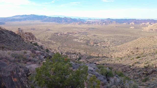 Aerial view of desert valley and rock formations seen from Ryan Mountain Trail in Joshua Tree National Park California