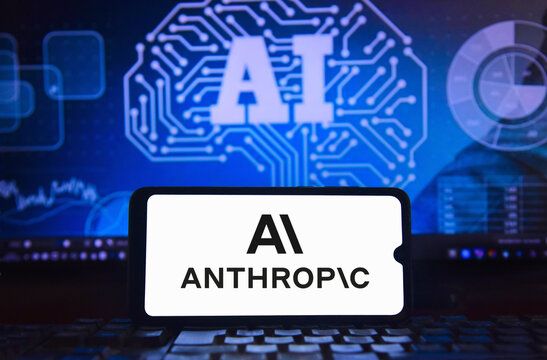 Anthropic logo on a cell phone screen with an image of artificial intelligence with integrated circuits, highlighting cutting-edge neural technology in the background.
