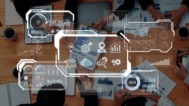 A high-angle view of a collaborative business meeting showcasing hands working over charts and graphs with digital analytics in a modern workspace environment. Raster